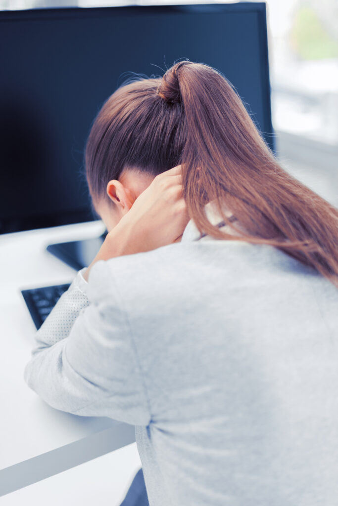 stressed woman computer PC mental wellbeing